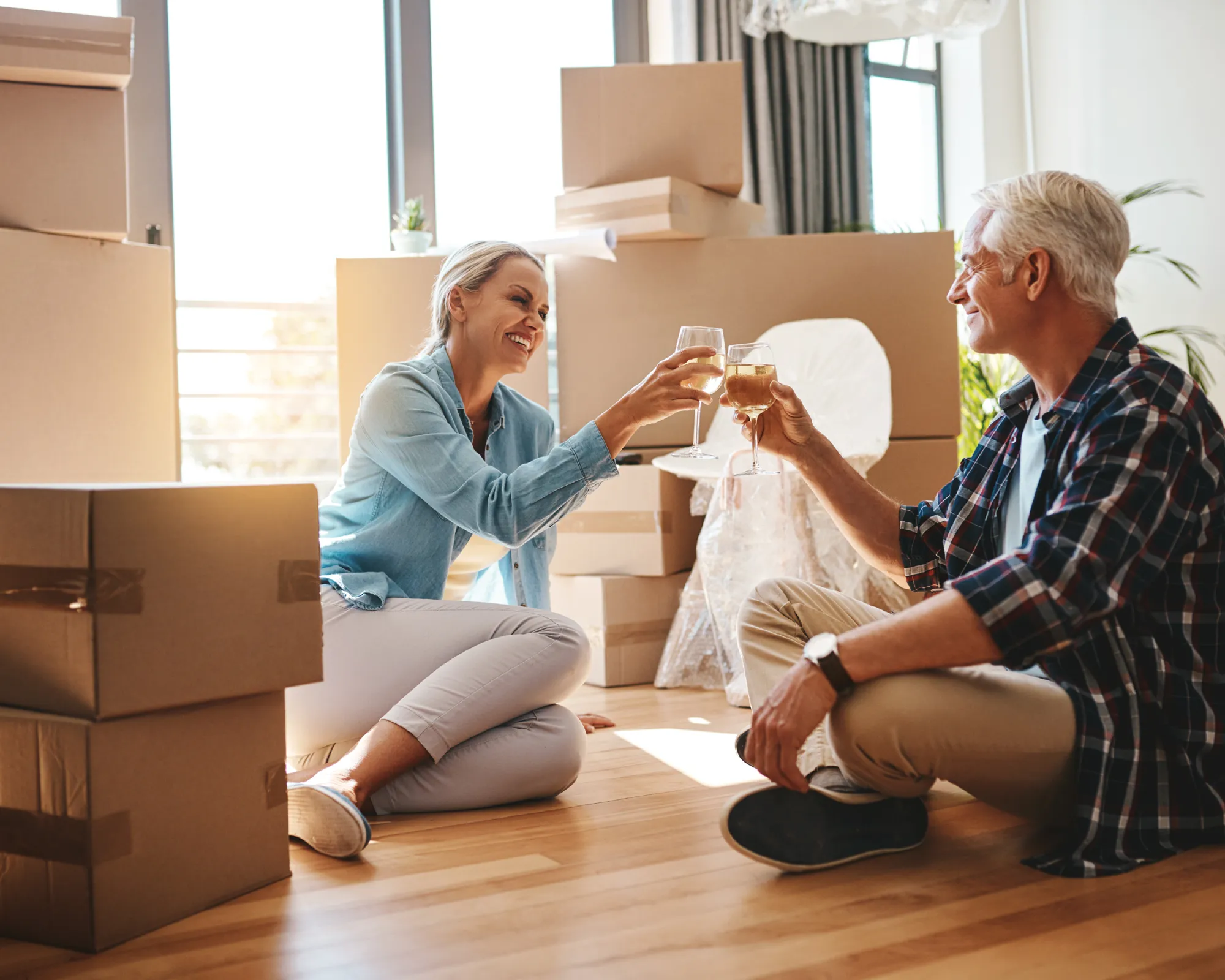 Older couple celebrating their new move.