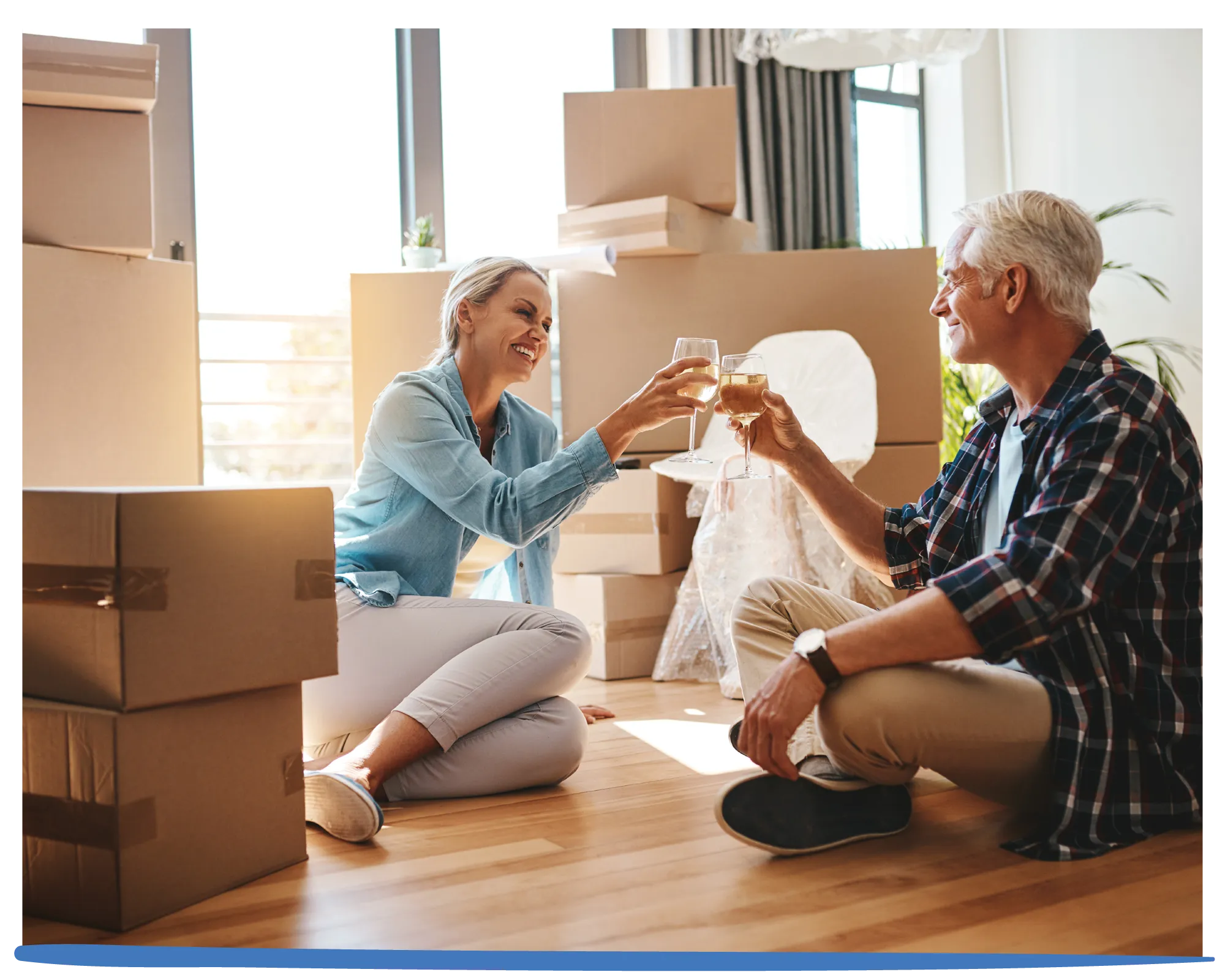 Older couple celebrating their new move.