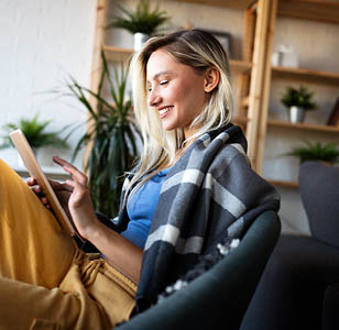 Women on couch using a tablet
